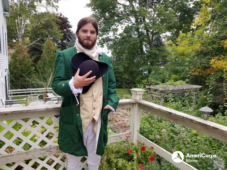 Photo of an individual posing for a photo while wearing a civil war era costume